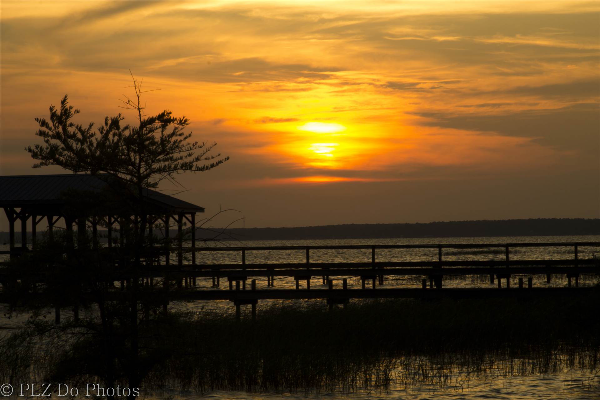 GOLDEN LAKE WACCAMAW The golden hour - sunset at Lake Waccamaw, NC by Patricia Zyzyk