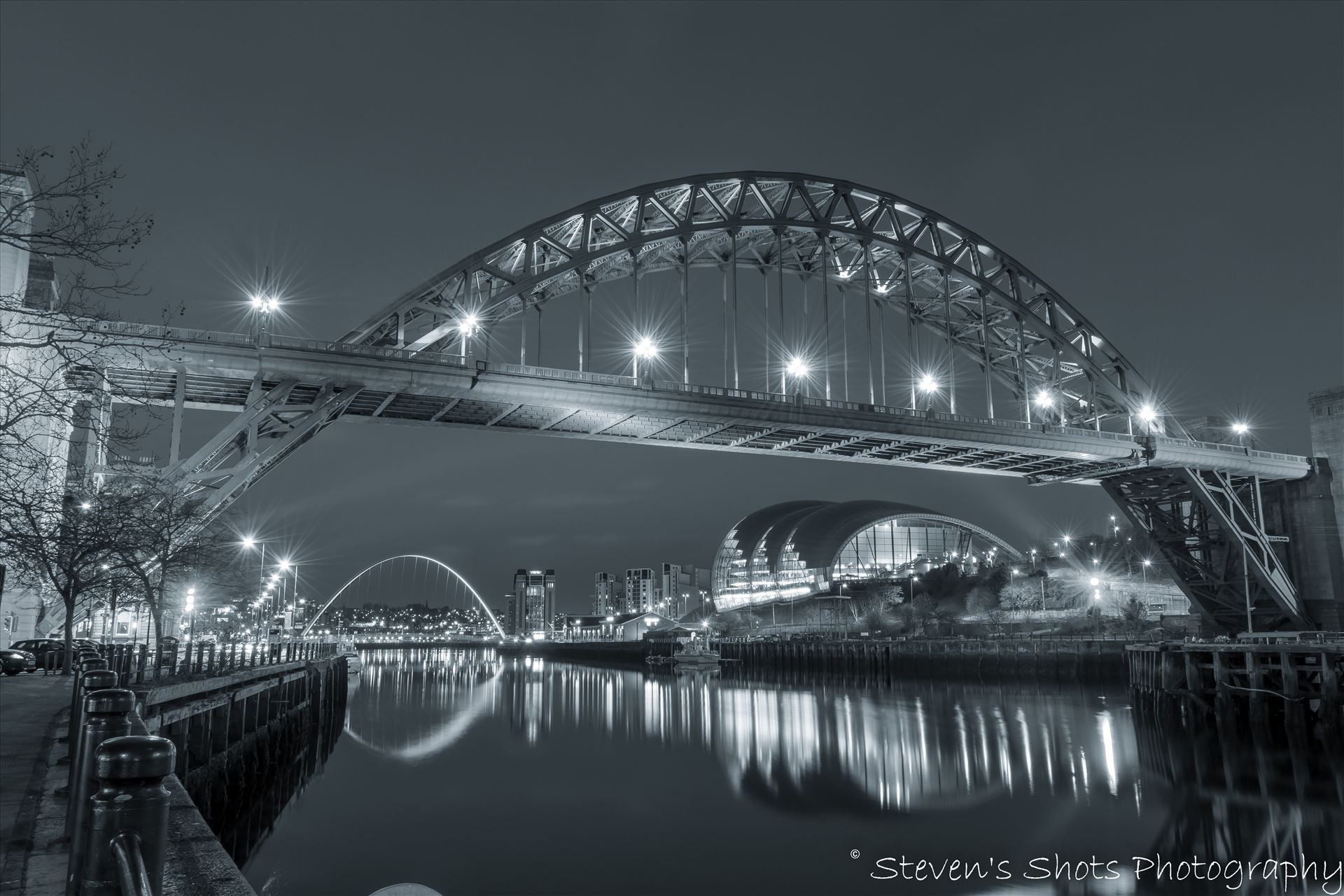 Tyne Bridge in black and white The Tyne Bridge in black and white, shot in front of the swing bridge looking down towards the Millennium Bridge on Newcastle quayside.  by Steven's Shots Photography