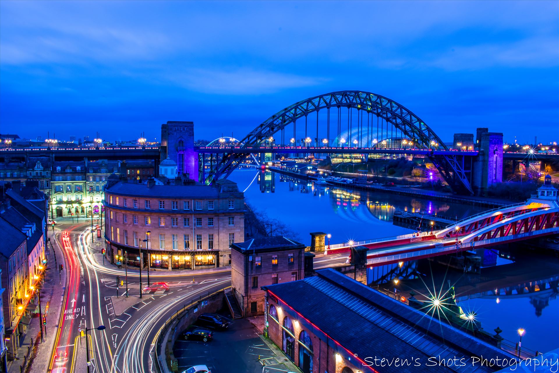 Swing Bridge and Tyne Bridge with traffic on the quayside A long exposure shot from the high level bridge in Newcastle, showing the Tyne Bridge and Swing Bridge with traffic down on the quayside. by Steven's Shots Photography