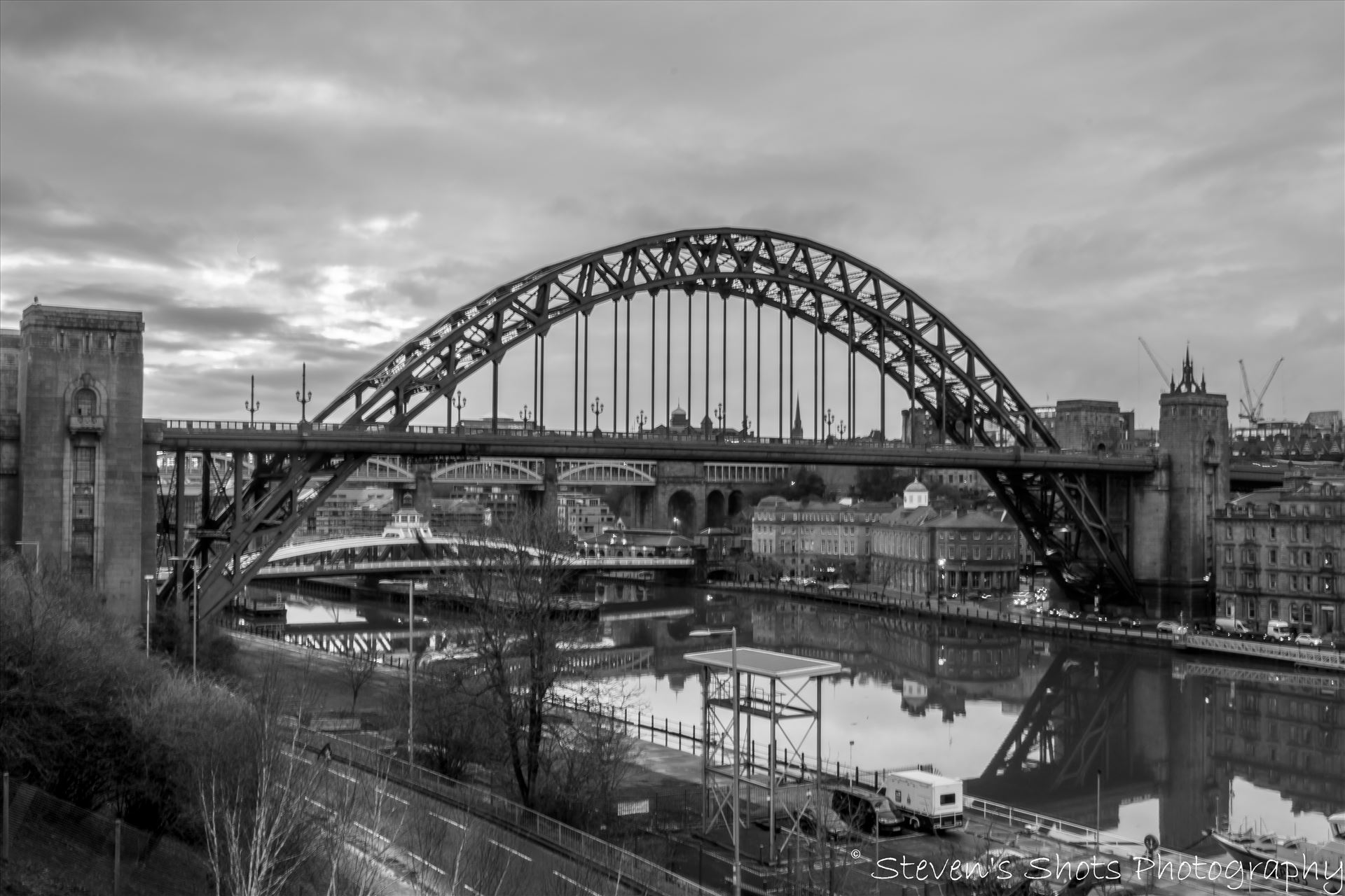 Tyne Bridge in black and white A shot of the Tyne Bridge in black and white from outside the Sage looking towards the Swing Bridge and High level bridge. by Steven's Shots Photography