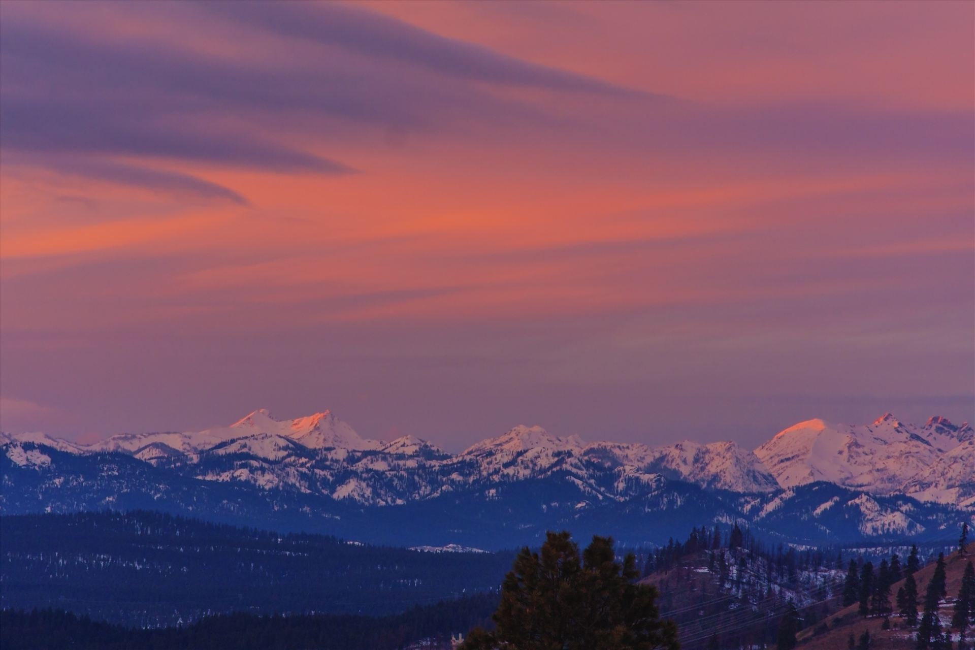 Sunset Over the Stuarts The mountains are the icon Stuart Range in Central Washington.  This was taken at sunset, as the clouds lit up and the setting sun shone on the snow capped peaks. by Bear Conceptions Photography