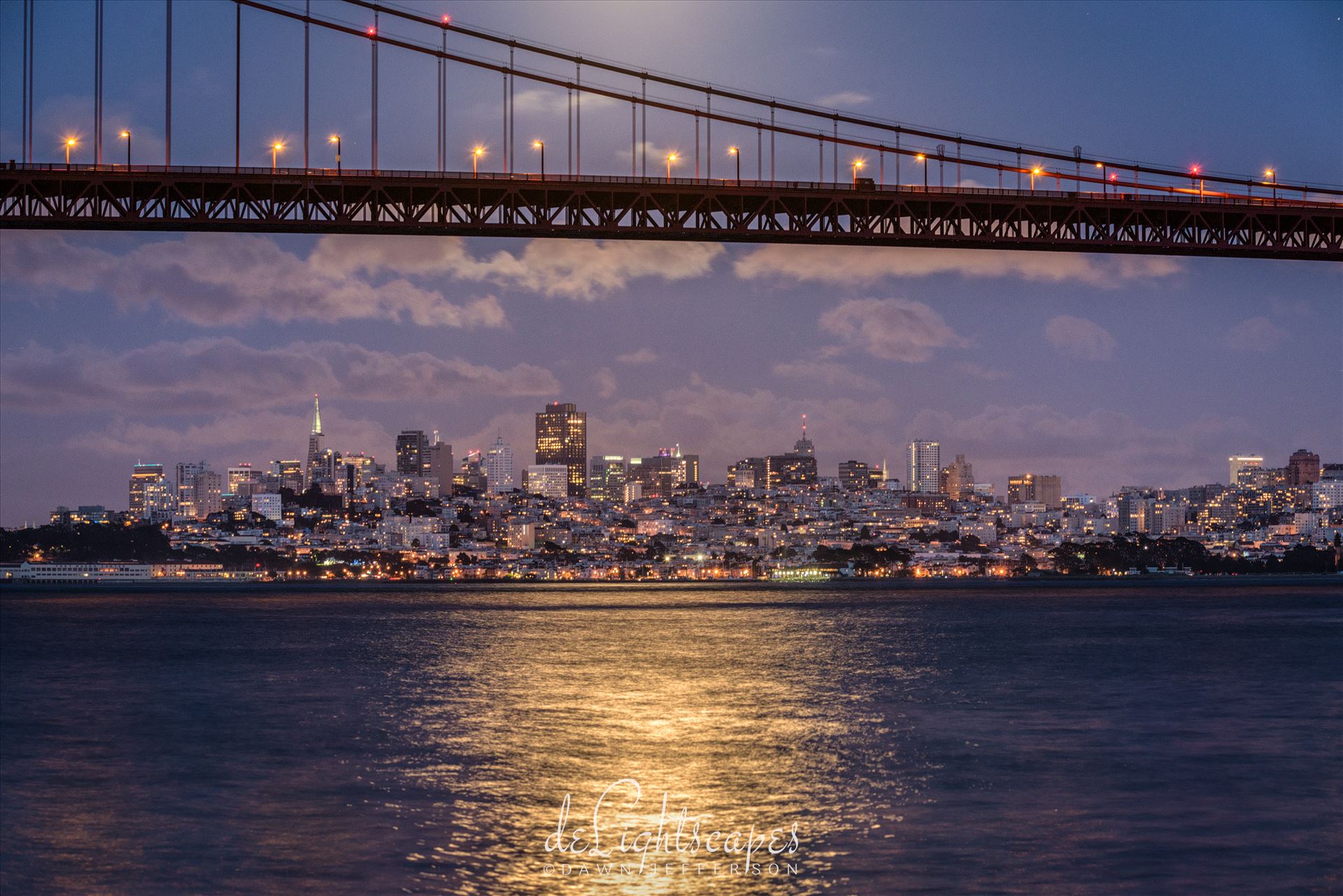 San Francisco by Moonlight A full moon rises above the Golden Gate Bridge illuminating the San Francisco skyline. by Dawn Jefferson
