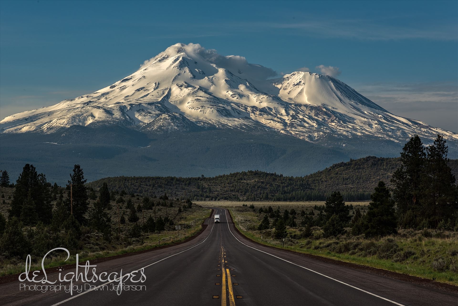 Caution: Volcano Ahead Mt Shasta is the 5th highest peak in California. It rises abruptly to 14,179 ft. Most prominently seen are the main summit and the satellite cone known as Shastina. by Dawn Jefferson