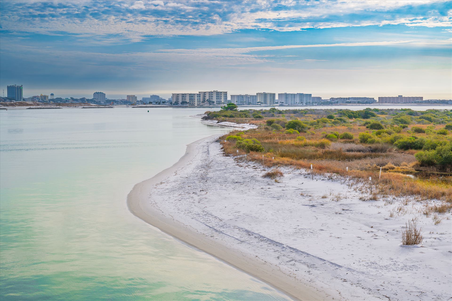 Destin Harbor Florida USA Destin Harbor Florida USA shines under a brilliant blue sky, with fluffy clouds reflecting on the emerald-green waters, creating a picture-perfect coastal scene. by Terry Kelly Photography