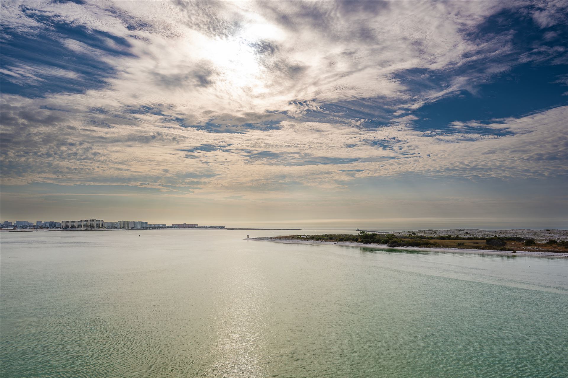 Destin Harbor Florida USA Destin Harbor Florida USA shines under a brilliant blue sky, with fluffy clouds reflecting on the emerald-green waters, creating a picture-perfect coastal scene. by Terry Kelly Photography