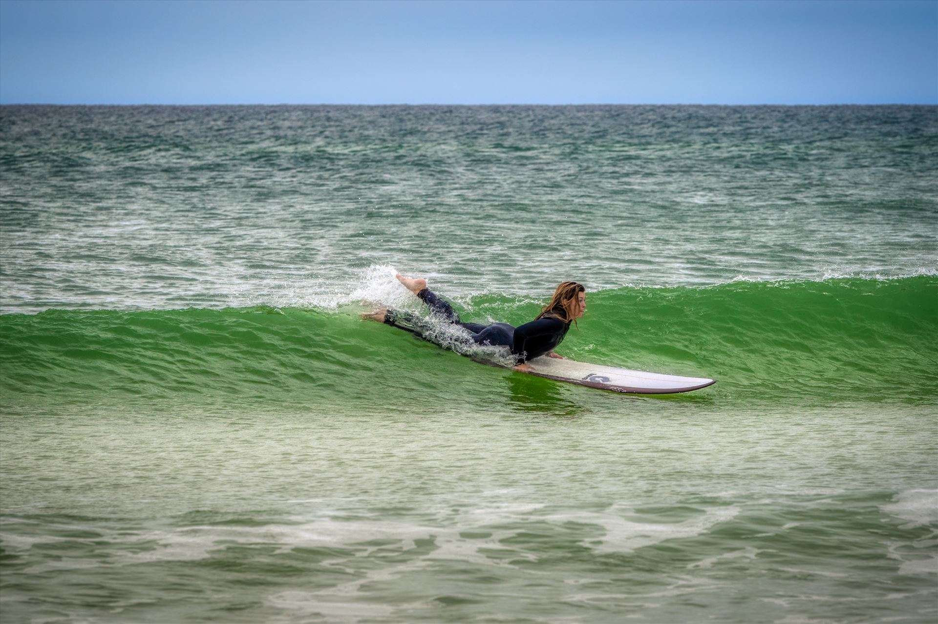 surfer girl Female surfer at St. Andrews State Park at the jetties by Terry Kelly Photography