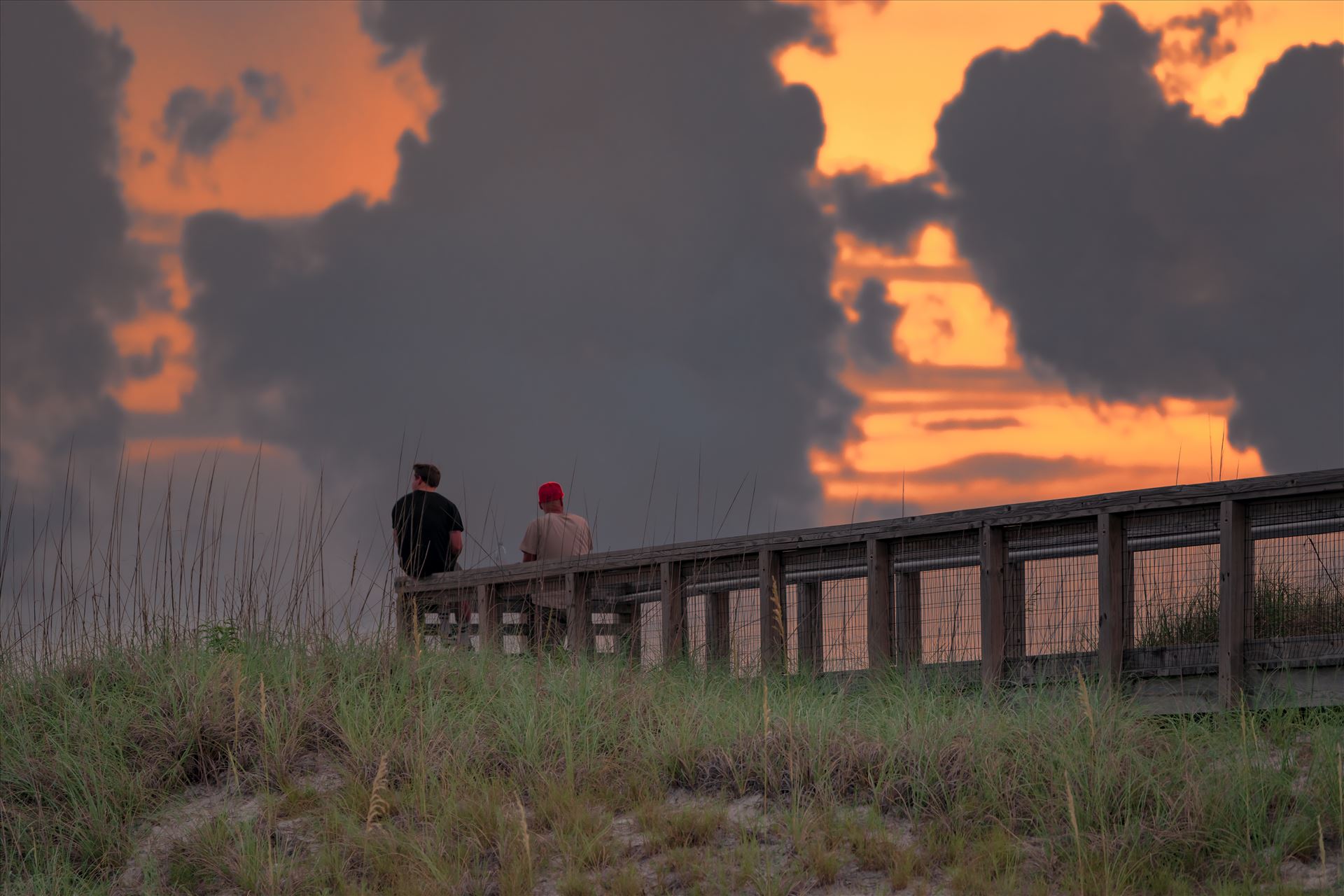 watching the sunset at St. Andrews State Park 8500436.jpg Two guys watching the sunset from the lookout at St. Andrews State Park, Panama City Beach, Florida by Terry Kelly Photography