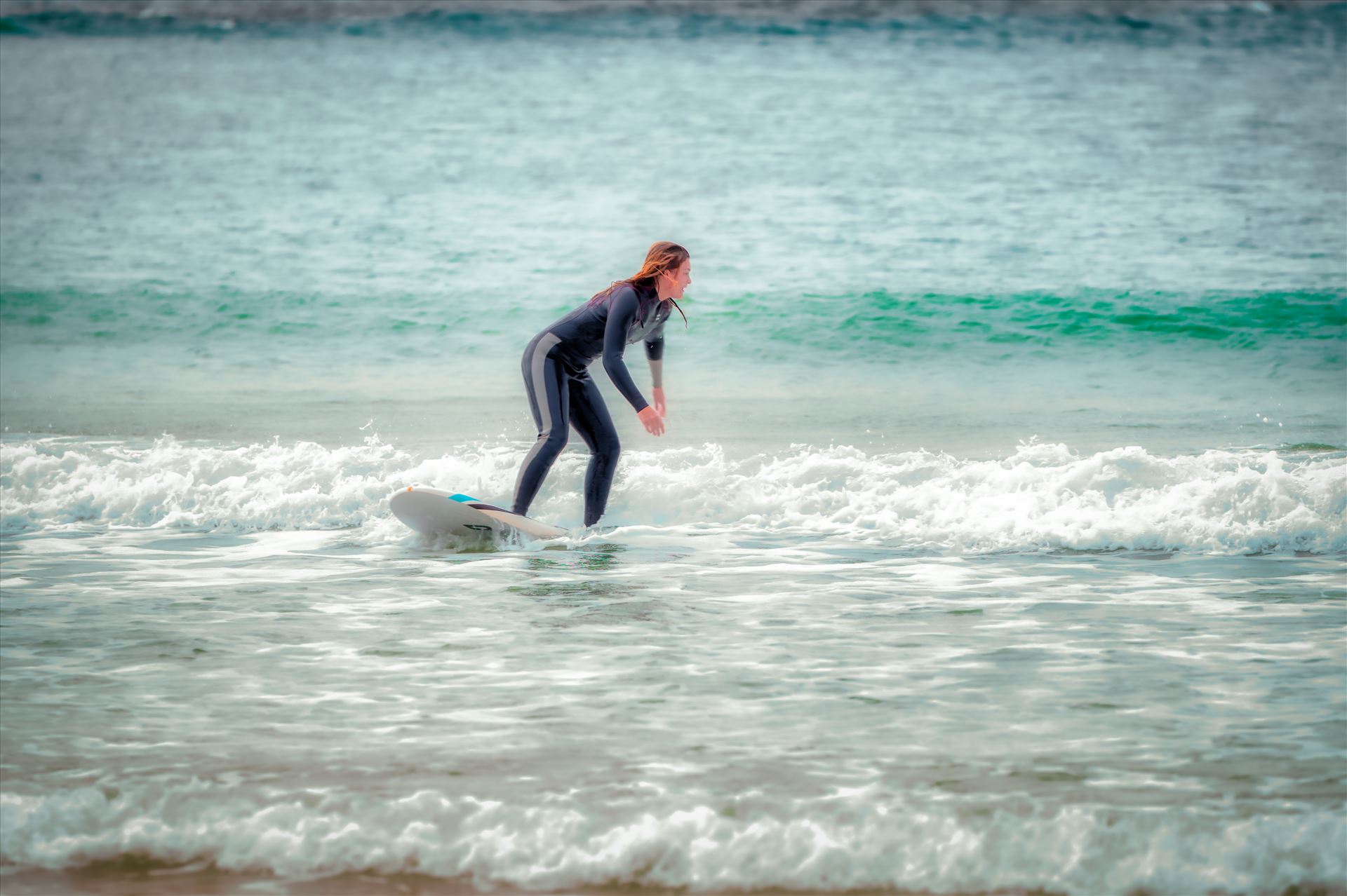 surfer girl Female surfer at St. Andrews State Park at the jetties. by Terry Kelly Photography