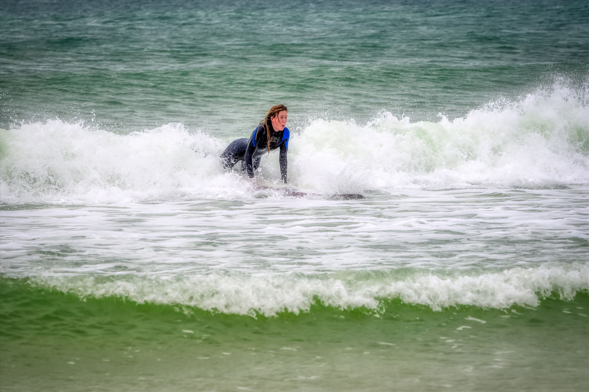 surfer girl Female surfer at St. Andrews State Park at the jetties by Terry Kelly Photography