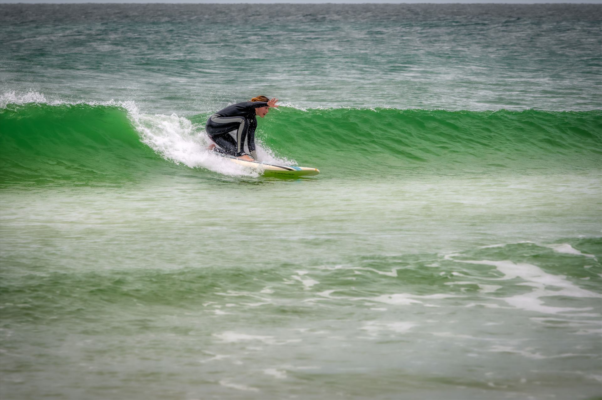 surfer girl Female surfer at St. Andrews State Park at the jetties by Terry Kelly Photography