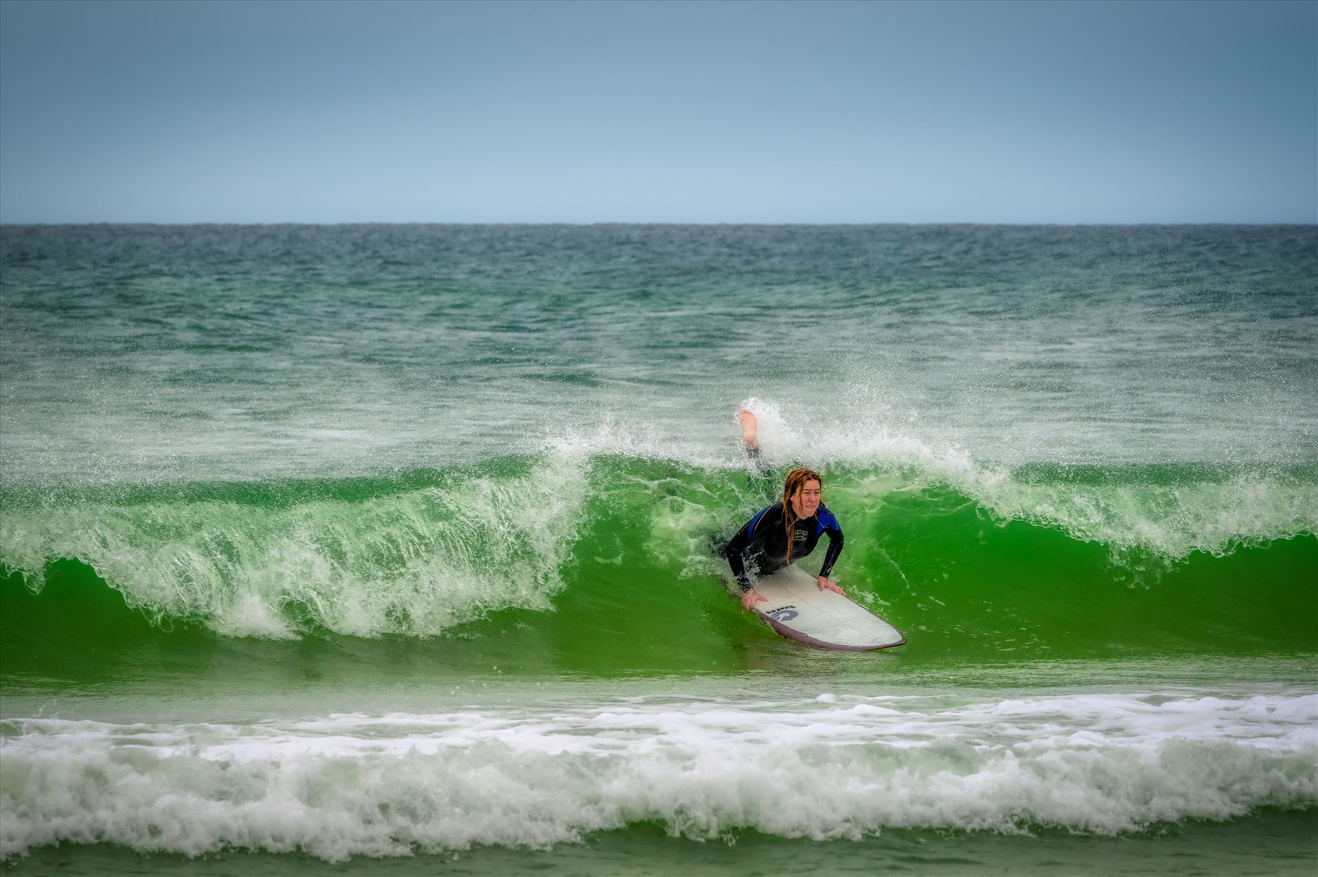 surfer girl Female surfer at St. Andrews State Park at the jetties by Terry Kelly Photography