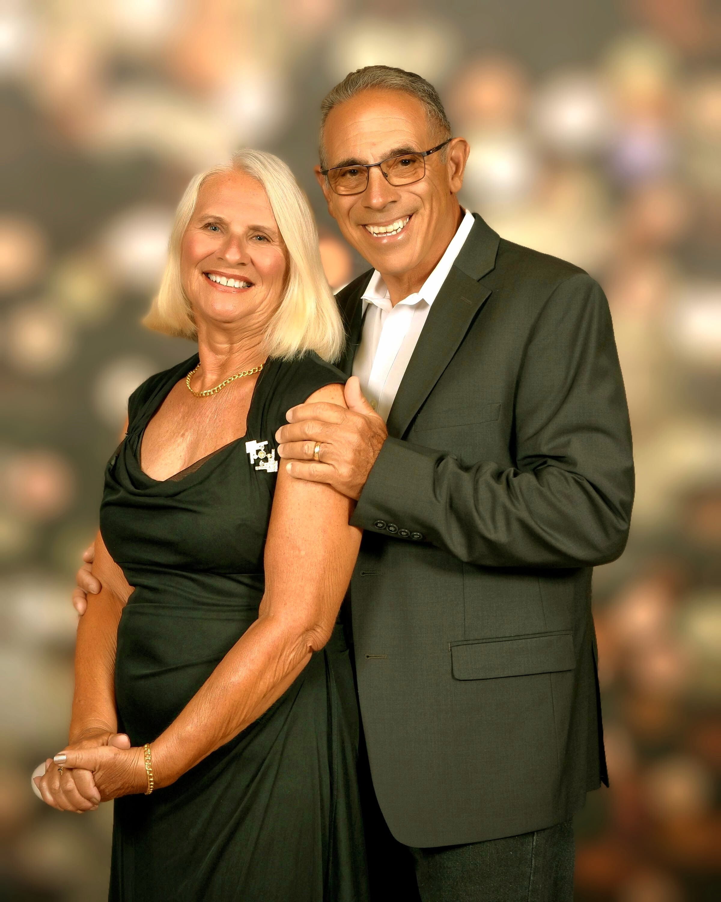Couple Posing in Formal Attire  by Moments Captured