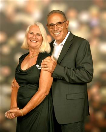 Couple Posing in Formal Attire by Moments Captured
