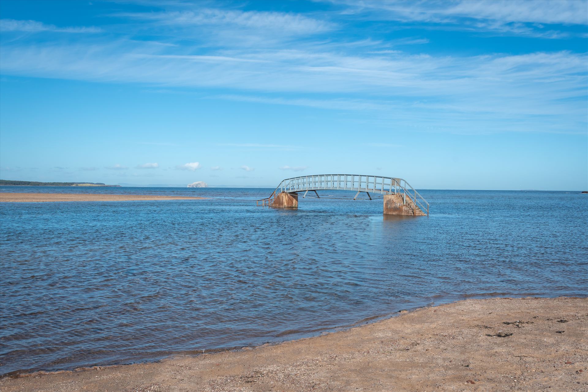 'Bridge to Nowhere’, Dunbar, Scotland When the tide comes surging into shore, what should be an easy path to the beach becomes suddenly impassable. At high tide, the water swallows the land around the bridge, making it look as though it’s stranded in the middle of a sea. by Graham Dobson Photography
