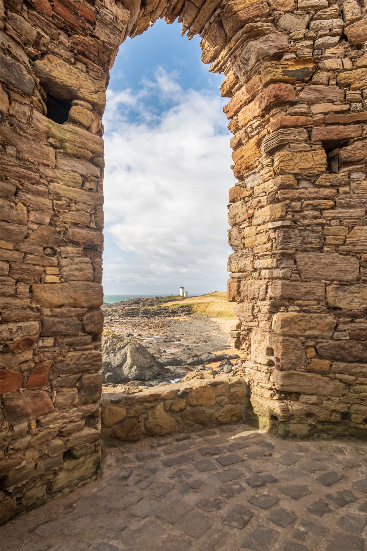 Lady Elie Tower, Elie, Scotland Lady Elie Tower, looking towards Elie lighthouse through arched window.  A changing tower for Lady Anstruther when bathing in the 1770s. by Graham Dobson Photography