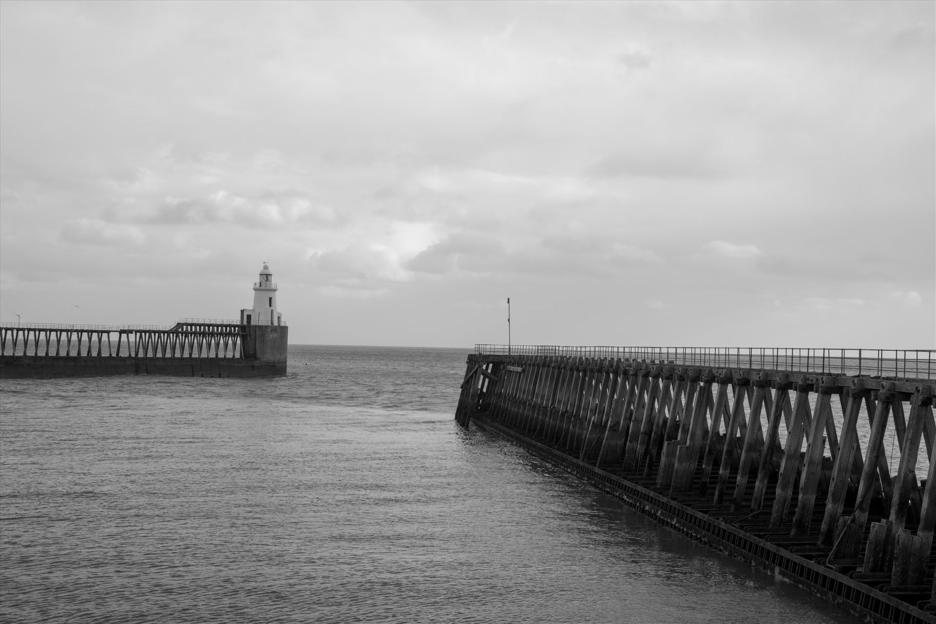 Blyth Pier and lighthouse, Northumberland, in B/W  by Graham Dobson Photography