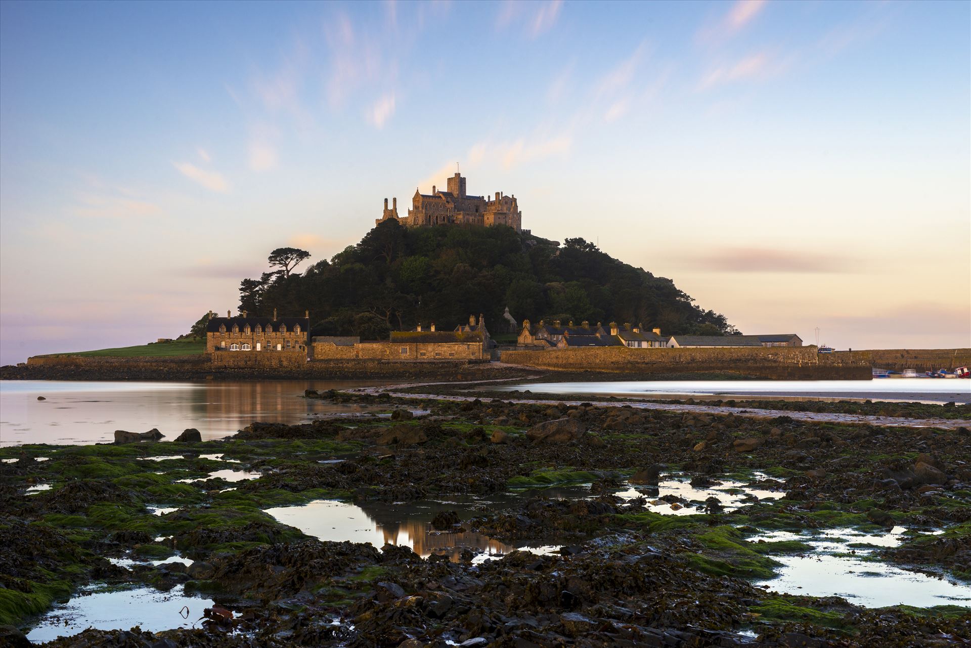 St. Michael's Reflection I decided to experiment with a different position to photograph St. Michael's Mount, by venturing onto the rocks. I was looking for any reflections to add some symmetry to my landscape. by James Etchells Photography