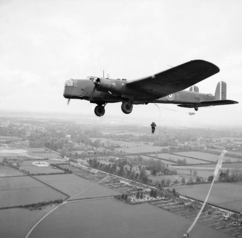Parachute_troops_jump_from_a_Whitley_bomber_during_a_demonstration_for_the_King_near_Windsor,_25_May_1941._H9955.jpg  by Tony