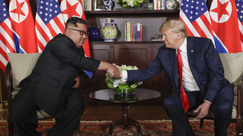 U. S. President Donald Trump shakes hands with North Korea leader Kim Jong Un during their first meetings at the Capella resort on Sentosa Island Tues دیدار تاریخی رهبران آمریکا و کره شمالی برگزار شد: ملاقات ترامپ و کیم by mohsen dehbashi