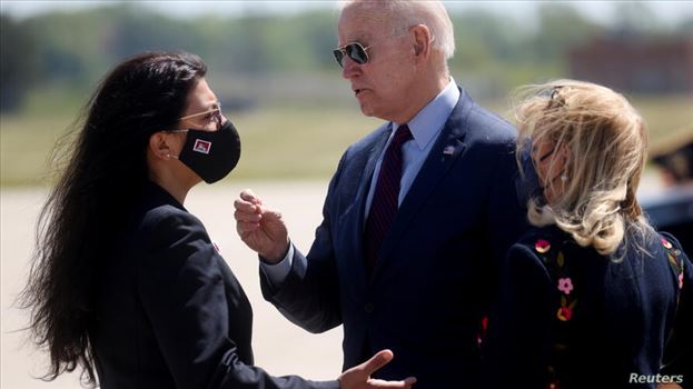 U.S. President Joe Biden is greeted by U.S. Rep. Debbie Dingell (D-MI) and U.S. Rep. Rashida Tlaib  at Detroit Metropolitan Wayne County Airport, Detr by mohsen dehbashi