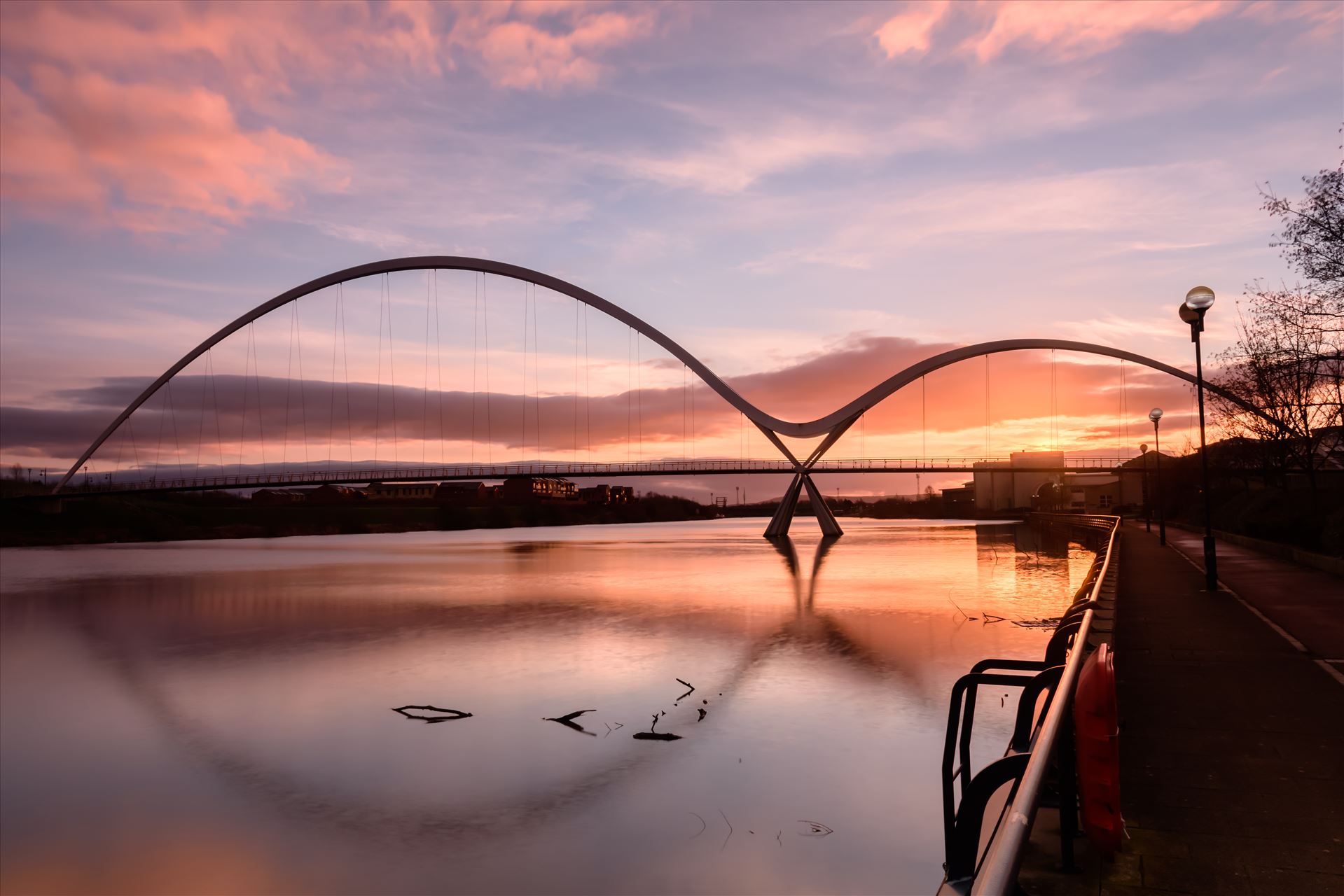 The Infinity Bridge 12 The Infinity Bridge is a public pedestrian and cycle footbridge across the River Tees that was officially opened on 14 May 2009 at a cost of £15 million. by philreay