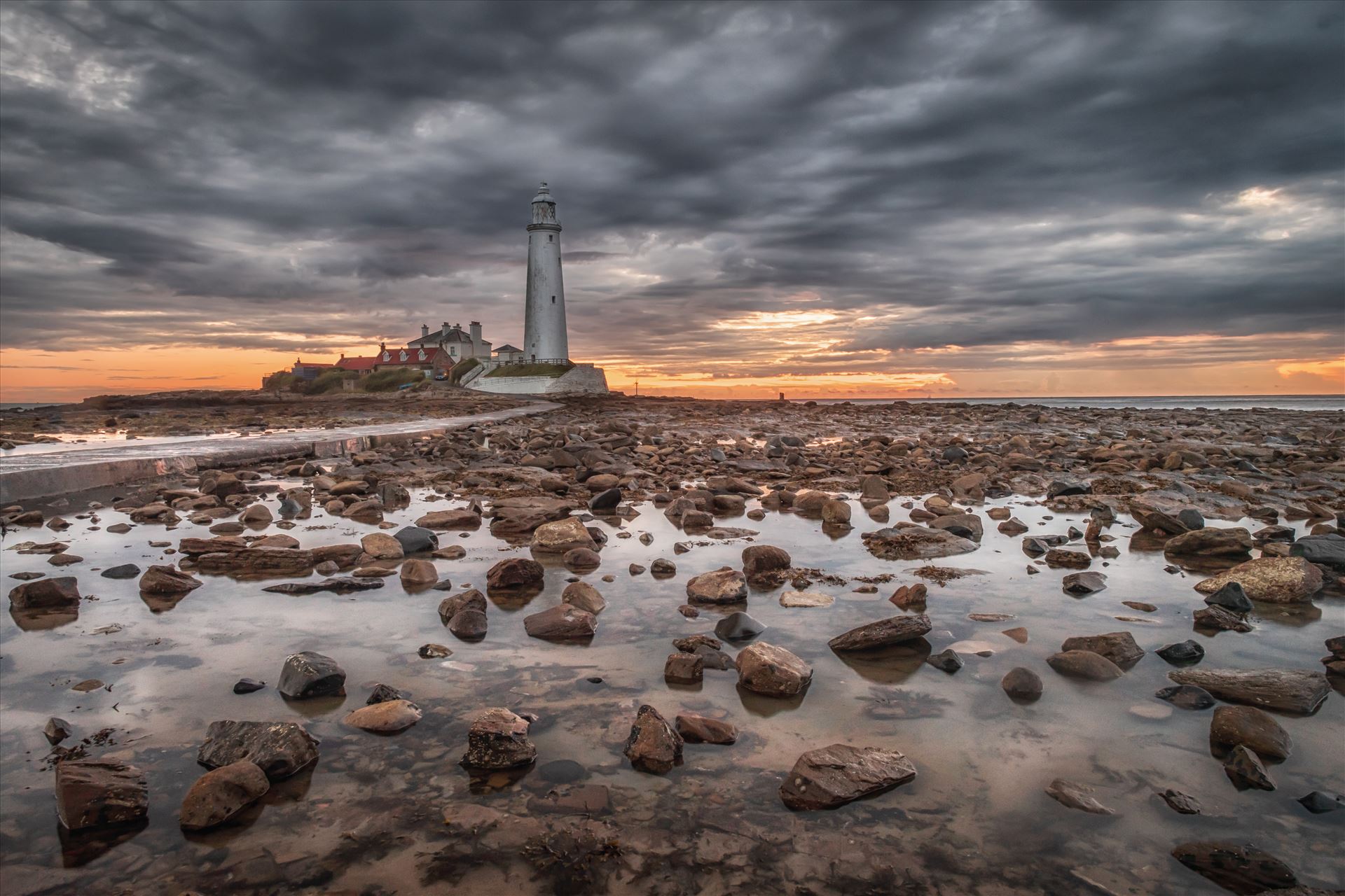 St Mary`s Lighthouse & island St Mary`s lighthouse stands on a small rocky tidal island is linked to the mainland by a short concrete causeway which is submerged at high tide. The lighthouse was built in 1898 & was decommissioned in 1984, 2 years after becoming automatic. by philreay