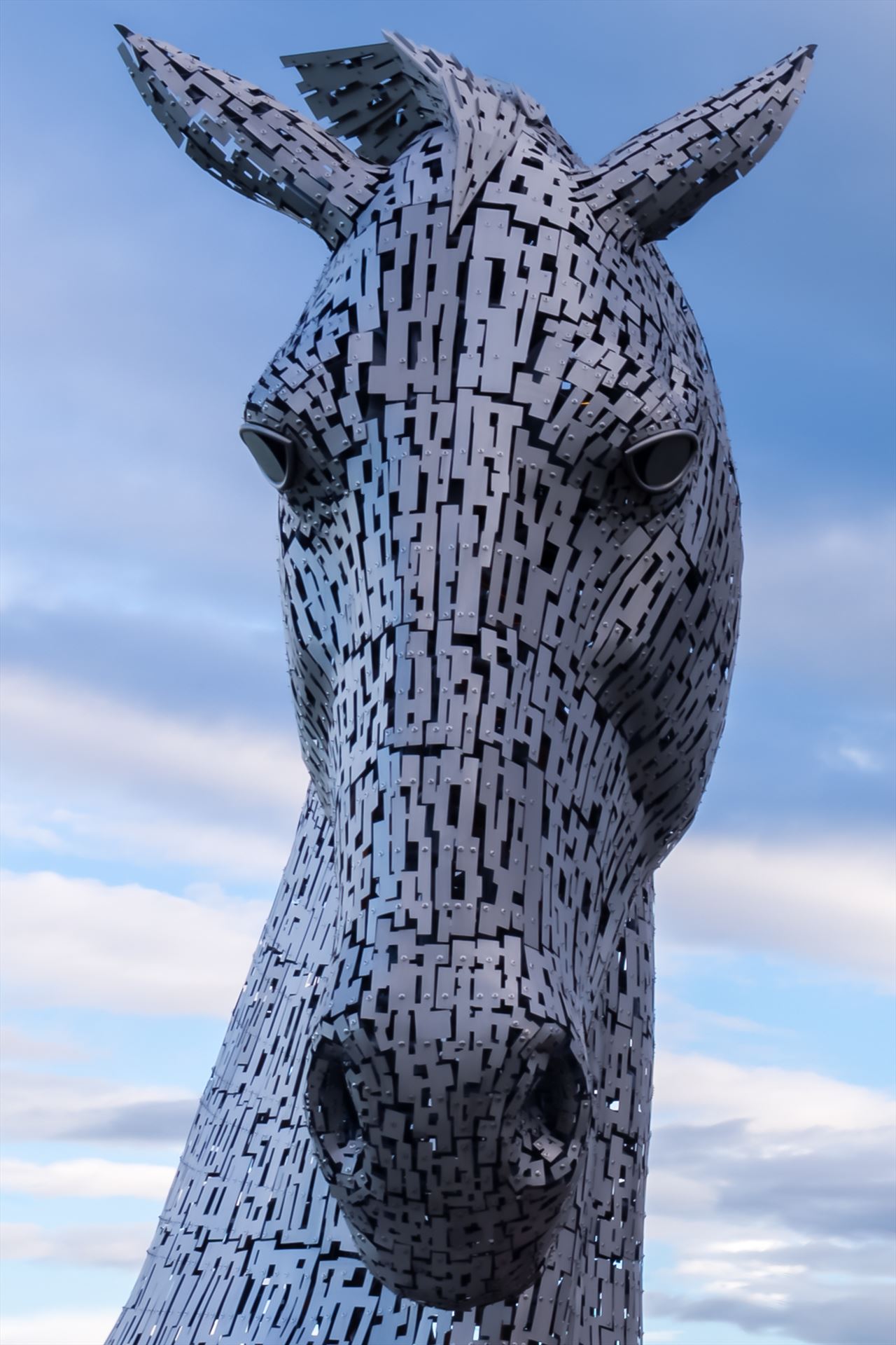 One of the Kelpies The Kelpies are 30-metre-high horse-head sculptures, standing next to a new extension to the Forth and Clyde Canal at Falkirk. The Kelpies are a monument to horse powered heritage across Scotland. by philreay