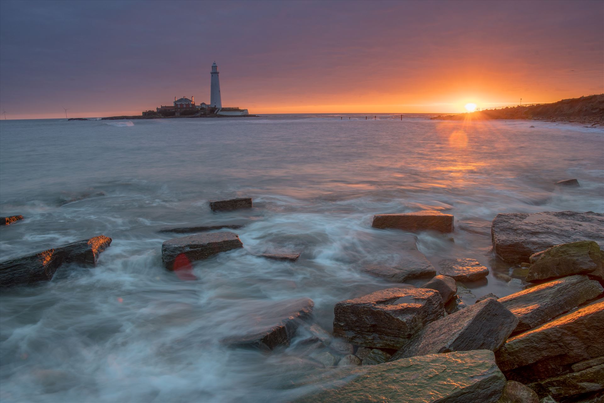 St Mary`s sunrise St Mary`s lighthouse stands on a small rocky tidal island is linked to the mainland by a short concrete causeway which is submerged at high tide. The lighthouse was built in 1898 & was decommissioned in 1984, 2 years after becoming automatic. by philreay