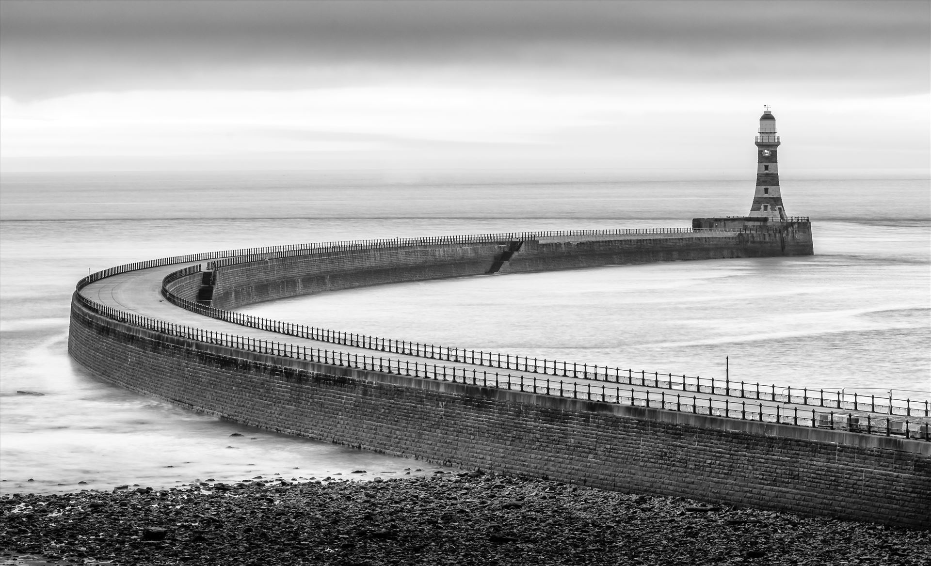 Roker Pier, Sunderland For over a hundred years, Roker Pier & Lighthouse has protected the entrance into Sunderland's harbour with the pier, and distinctive red and grey granite hoops of the lighthouse, as one of the City's most iconic landmarks. by philreay