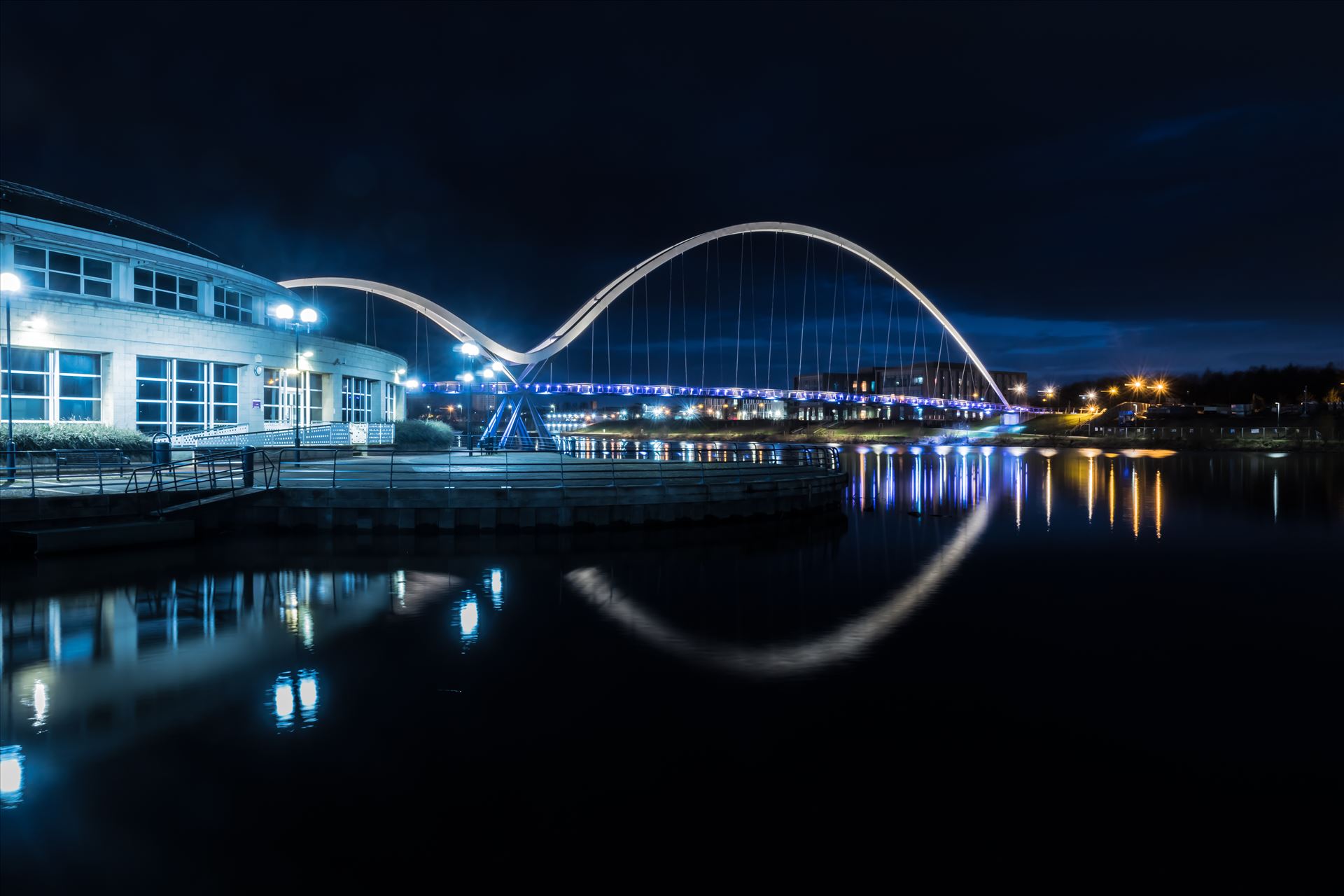 The Infinity Bridge 07 The Infinity Bridge is a public pedestrian and cycle footbridge across the River Tees that was officially opened on 14 May 2009 at a cost of £15 million. by philreay