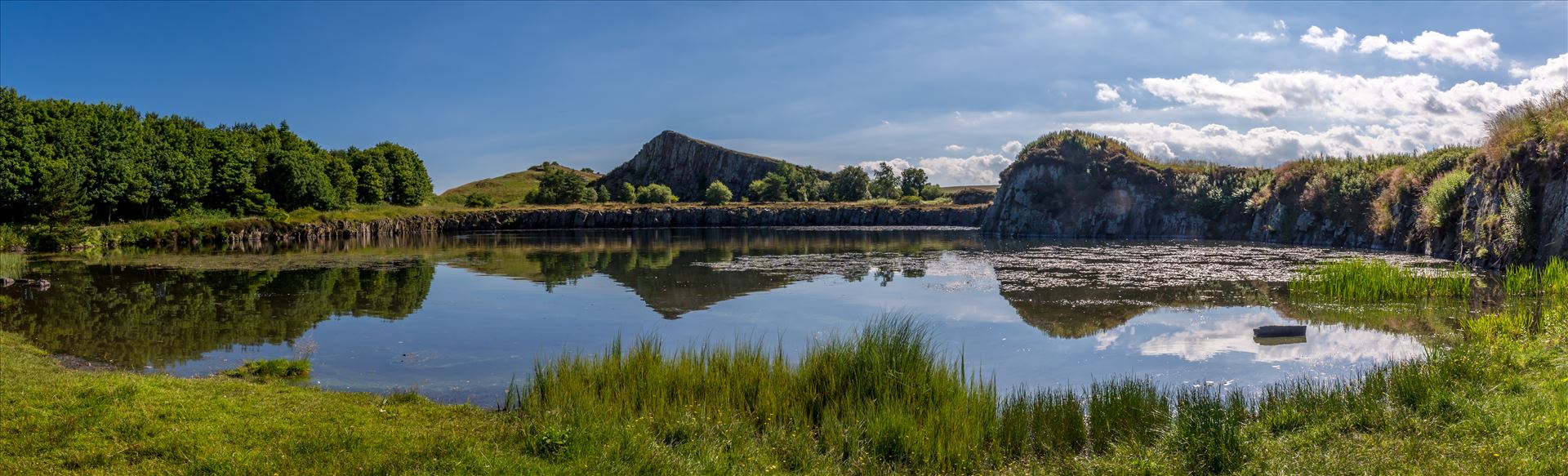 Cawfields Quarry Cawfields is a former quarry cutting dramatically through the Wall and the underlying Whin Sill dolerite bedrock. It comprises a large pond and car park with good walking access to Milecastle 42 on the Roman Wall. by philreay
