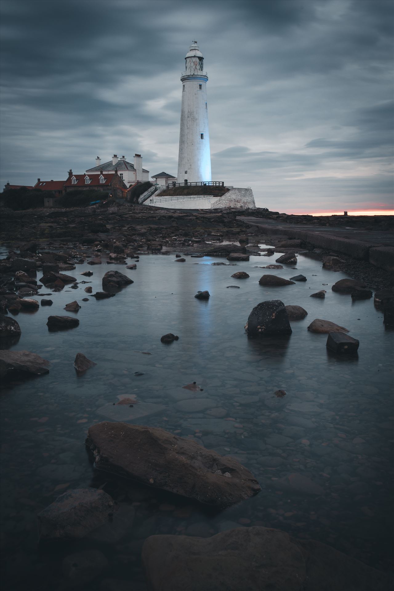 St Mary`s Island & lighthouse St Mary`s lighthouse stands on a small rocky tidal island is linked to the mainland by a short concrete causeway which is submerged at high tide. The lighthouse was built in 1898 & was decommissioned in 1984, 2 years after becoming automatic. by philreay