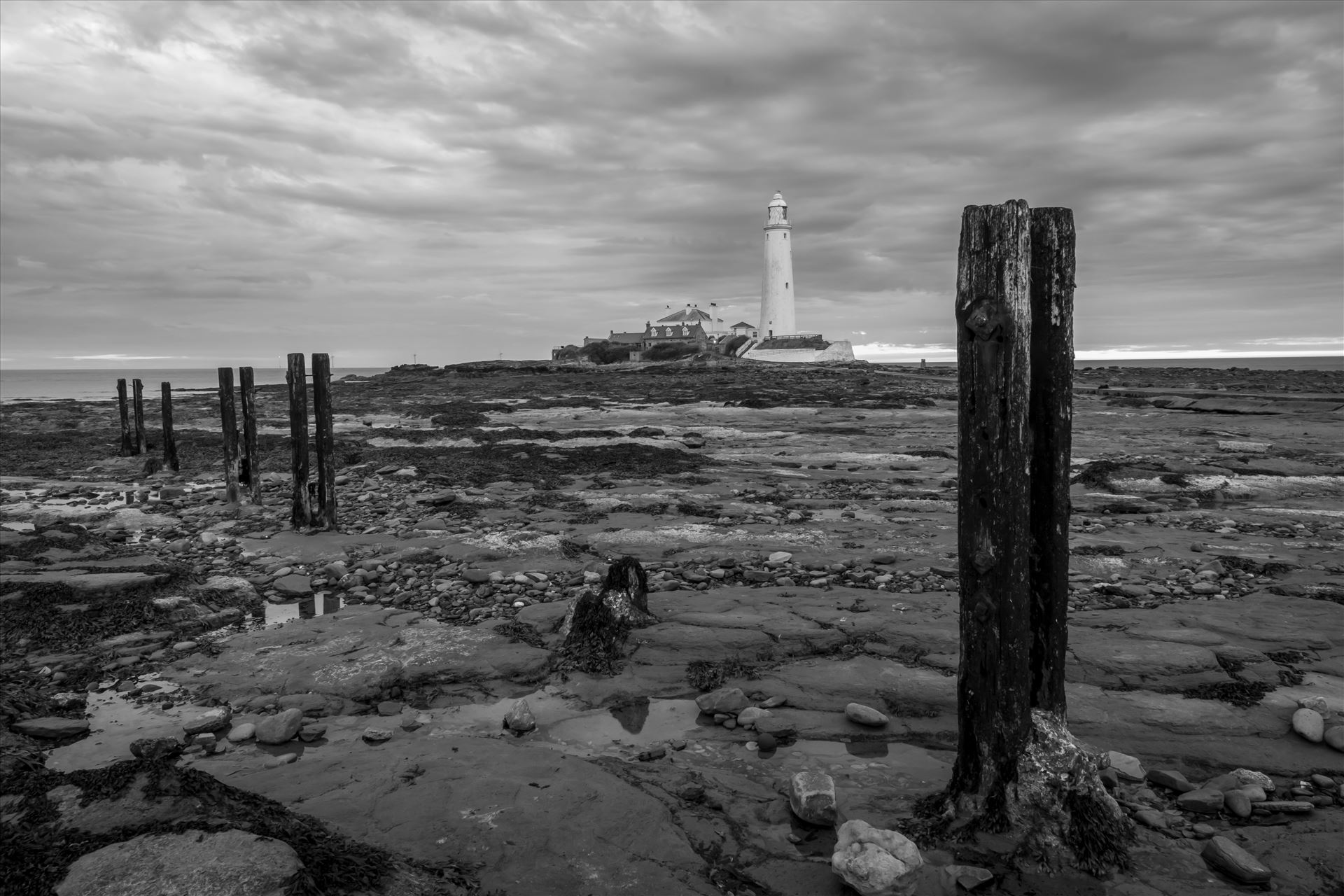 St Mary`s Island & lighthouse St Mary`s lighthouse stands on a small rocky tidal island is linked to the mainland by a short concrete causeway which is submerged at high tide. The lighthouse was built in 1898 & was decommissioned in 1984, 2 years after becoming automatic. by philreay