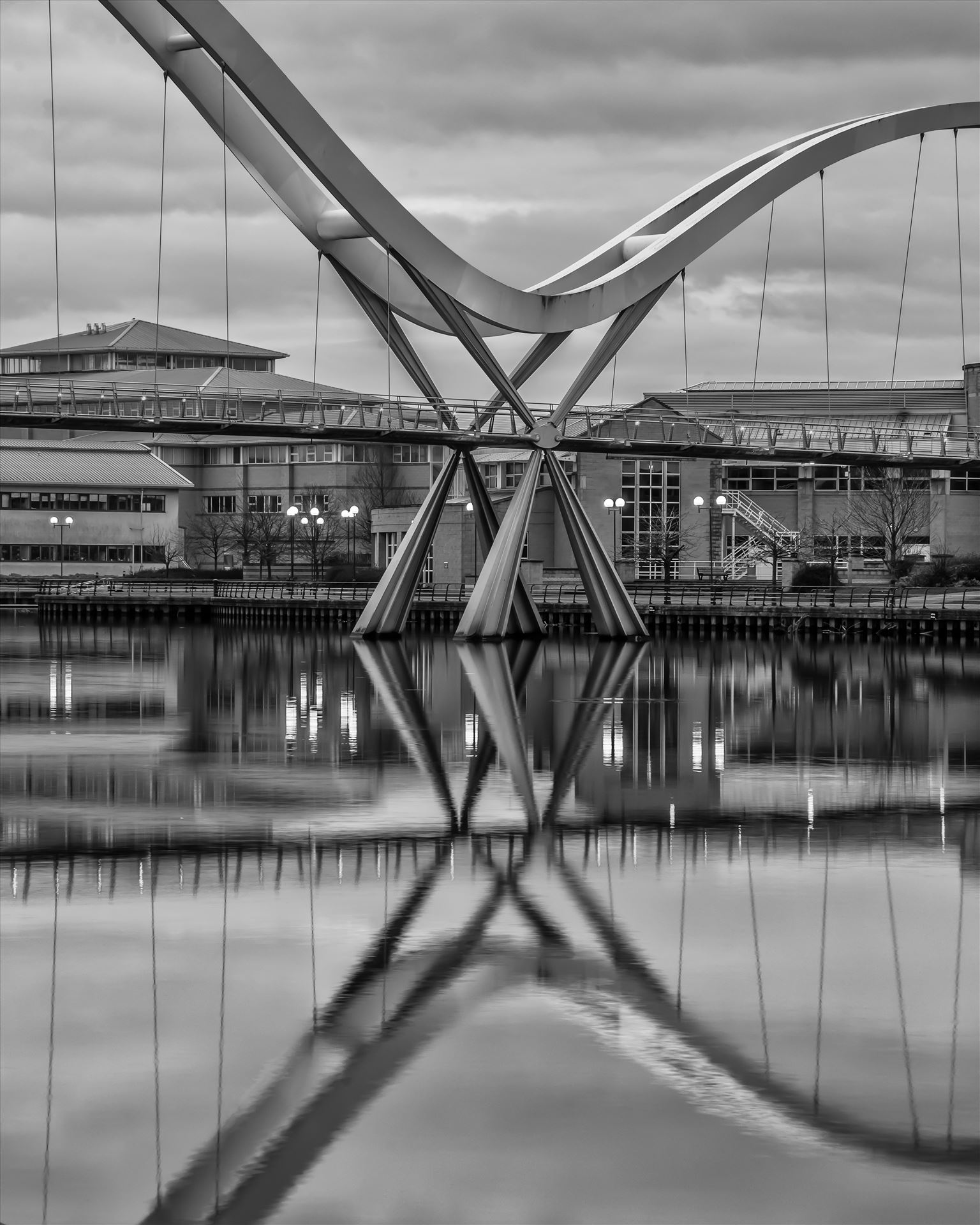 The Infinity Bridge 02 The Infinity Bridge is a public pedestrian and cycle footbridge across the River Tees that was officially opened on 14 May 2009 at a cost of £15 million. by philreay