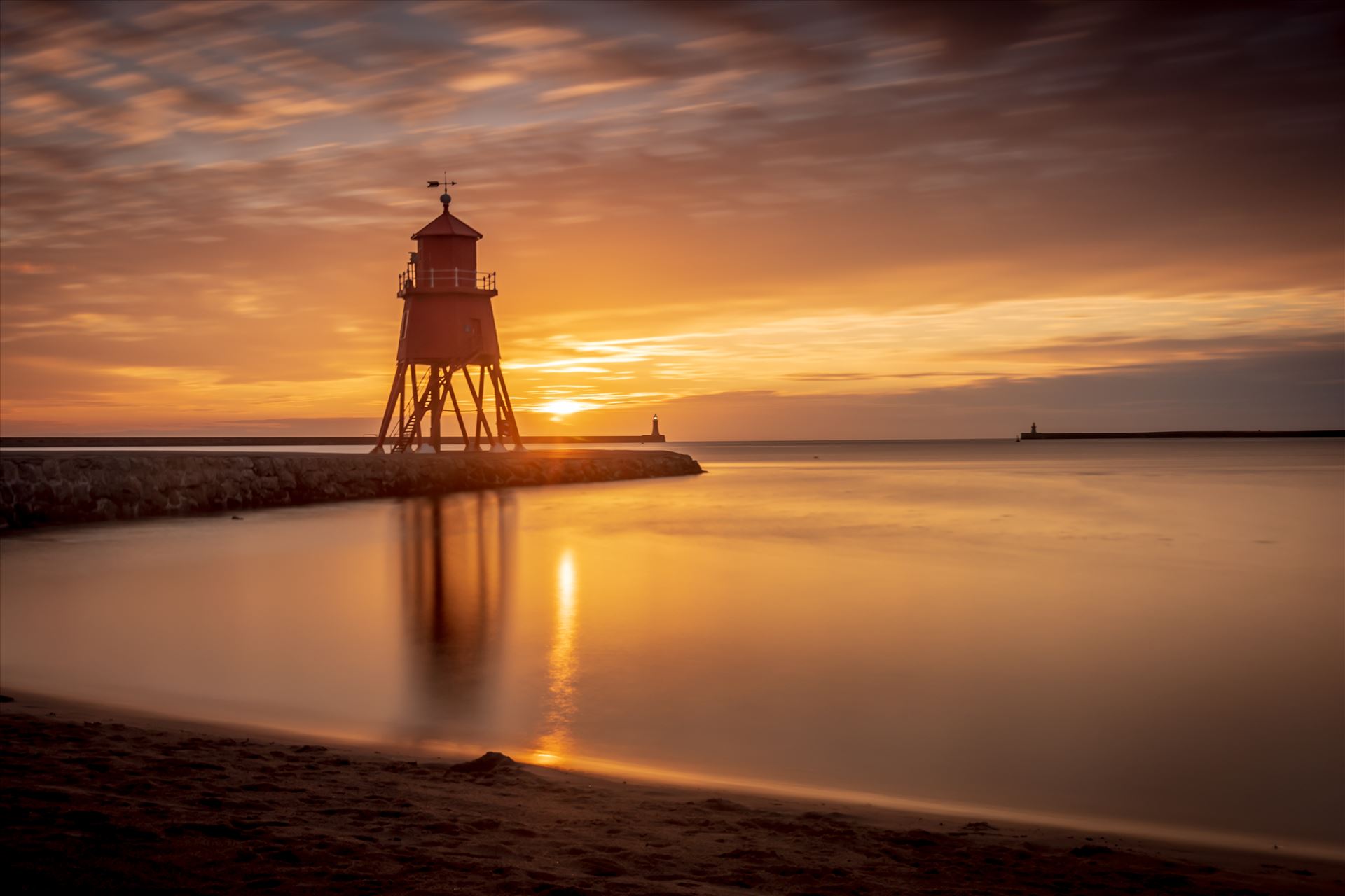 Herd Groyne lighthouse, South Shields at sunrise-long exposure  by philreay