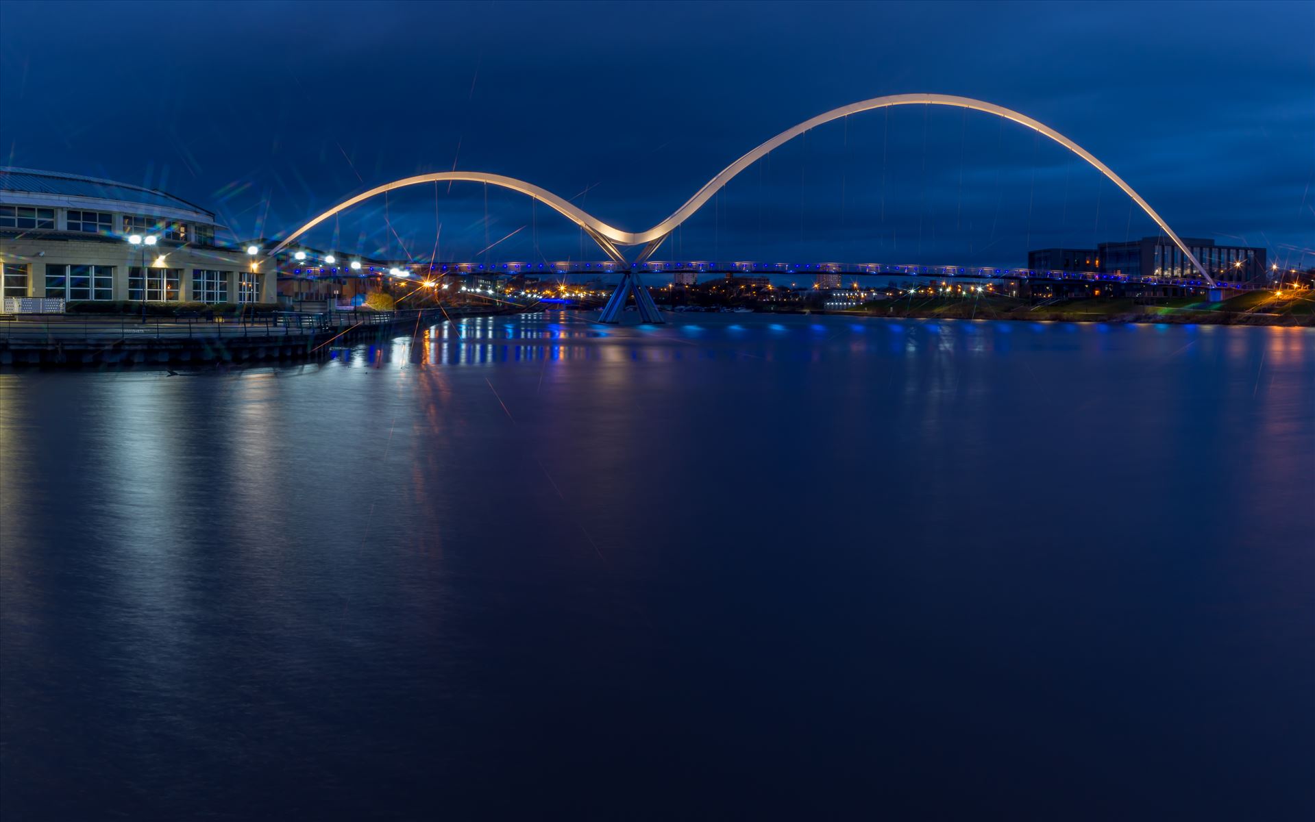 The Infinity Bridge 15 The Infinity Bridge is a public pedestrian and cycle footbridge across the River Tees that was officially opened on 14 May 2009 at a cost of £15 million. by philreay