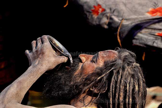 Culture- Naga Sadhu’s, Varanasi, Uttar Pradesh, India. (Photo: Atul Sharma) A Naga Sadhu having water at Ghats in Varanasi, Uttar Pradesh, India. by Anil