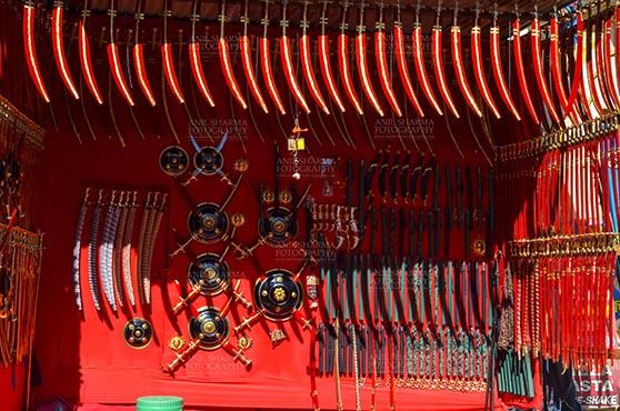 Fairs- Pushkar Fair (Rajasthan) DSC_0063-1 Pushkar, Rajasthan, India- January 16, 2018: A shop of traditional Rajasthani swords at Sadar Bazaar, Pushkar, Rajasthan, India. by Anil