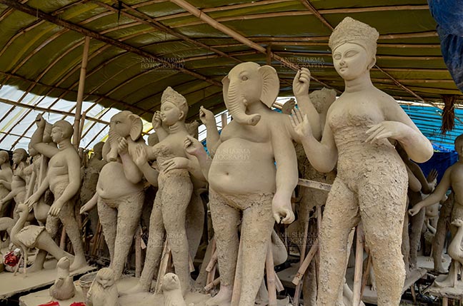 Festivals- Durga Puja Festival, Noida, India. (Photo: Anil Sharma) Durga Puja, Noida, India- Clay idols of Hindu Gods and Goddesses in a workshop under Preparation for the traditional Durga Puja at Noida, India. by Anil