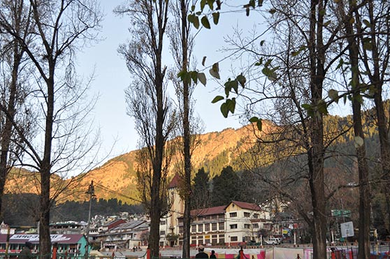 Travel- Nainital (Uttarakhand) Nainital, Uttarakhand, India- November 11, 2015: View of Cheena peak and Nainital city from Boat House Club at Mallital, Nainital, Uttarakhand, India. by Anil