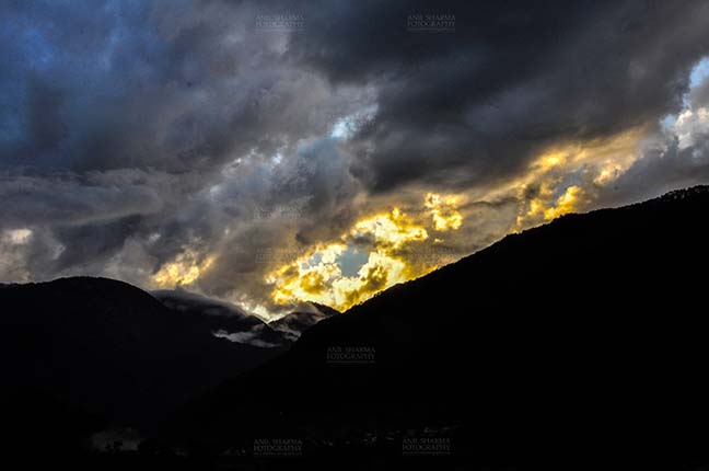 Clouds- Sky with Clouds (Uttarkashi) Clouds over Uttarkashi Hills, Uttarakhand, India-  June 17, 2013: Dark sky in the evening with Yellow-black clouds over the hills of Uttarkashi, Uttarakhand, India. by Anil