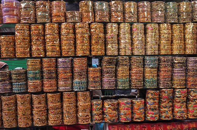 Religion- Dargah Sharif, Ajmer, Rajasthan (India) Colourful bangles shop at shine market place of Ajmer Sharif Dargah the Mausoleum of Moinuddin Chishti, a sufi saint from India at Ajmer, Rajasthan, India. by Anil