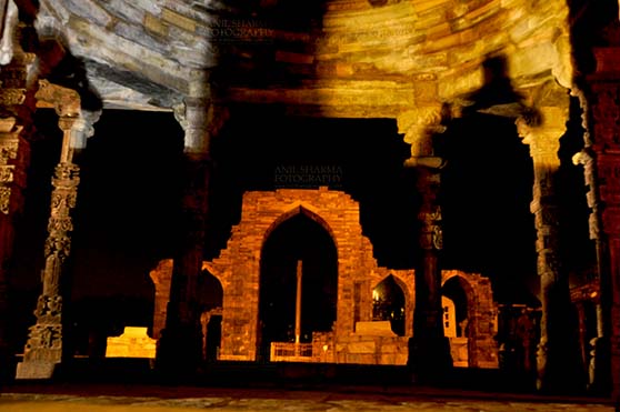 Monuments- Qutab Minar, New Delhi, India. (Photo: Atul Sharma) Qutab Minar, Mehrauli, New Delhi, India- October 25, 2010: Beauty of arches of  Iltutmish screen and iron pillar in night at Qutub Minar Complex, Mehrauli , New Delhi, India. by Anil