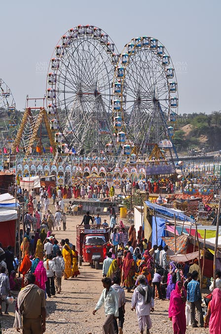 Fairs- Baneshwar Tribal Fair Baneshwar, Dungarpur, Rajasthan, India- February 14, 2011: Joy ride on Ferris wheel is the other attraction for the tourists and devotees at Baneshwar, Dungarpur, Rajasthan, India. by Anil