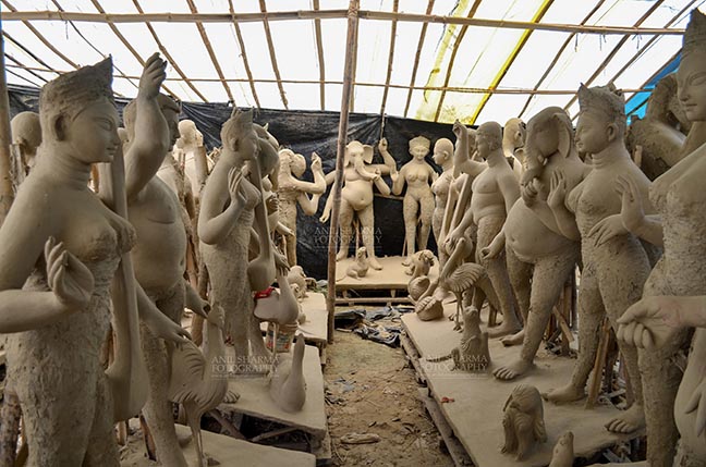 Festivals- Durga Puja Festival Durga Puja Festival, Noida, Uttar Pradesh, India- September 17, 2017: Clay idol sculpture of Hindu Goddess and Gods at a workshop in preparation for the “Durga Puja” the biggest festival of Hindu community in Indian subcontinent. by Anil