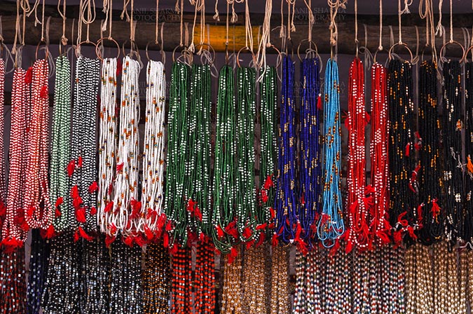 Fairs- Baneshwar Tribal Fair Baneshwar, Dungarpur, Rajasthan, India- February 14, 2011: Necklaces, beads, jewelry, gemstones, bracelets, earrings, bangles shop at Baneshwar, Dungarpur, Rajasthan, India by Anil