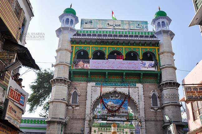 Religion- Dargah Sharif, Ajmer, Rajasthan, India. (Photo: Atul Sharma) Main entrance viewed from market, Ajmer Sharif Dargah the Mausoleum of Moinuddin Chishti, a sufi saint from India at Ajmer, Rajasthan, India. by Anil
