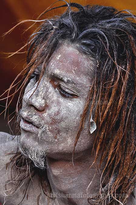 Culture- Naga Sadhu’s (India) Close up of a young Naga Sadhu at Varanasi Ghat. by Anil