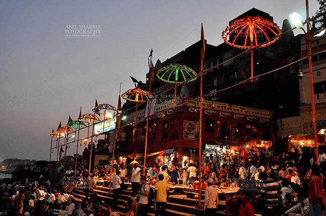Travel- Varanasi the city of light (India) Devotees waiting for evening aarti at Varanasi, Uttar Pradesh, India. by Anil