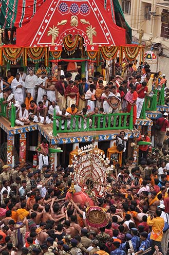 Festivals- Jagannath Rath Yatra (Odisha) Deity of Balbhadra being taken to the chariot on the occasion of Rath Yatra at Puri, Odisha, India. by Anil